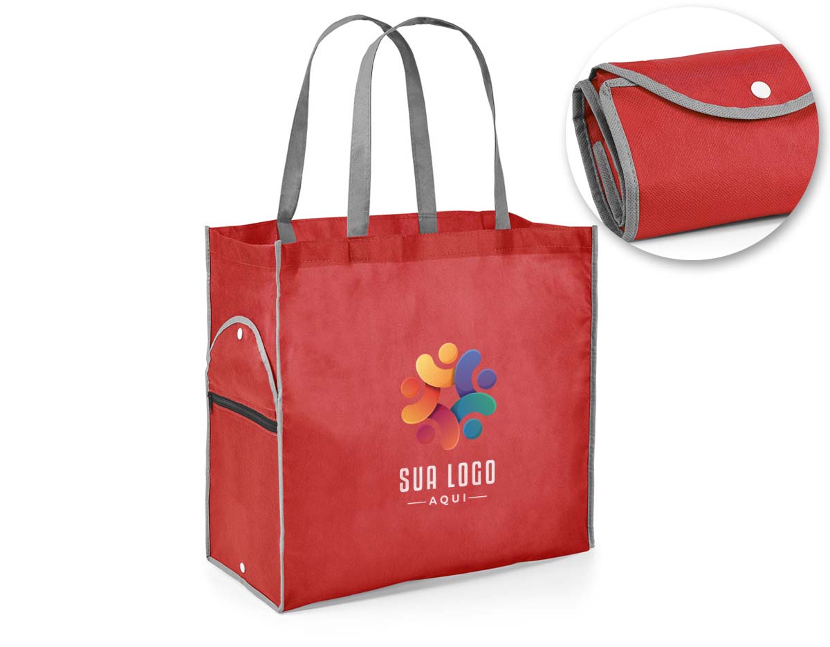 Sacola dobrável. Non-woven: 80 g/m². Alças de 65 cm. Dobrado: 200 x 120 mm| Aberto: 400 x 450 x 200 mm.