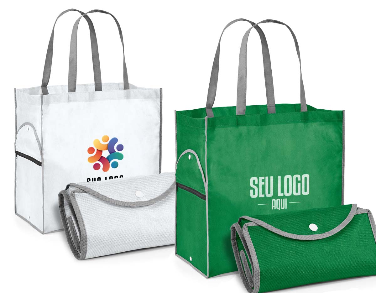 Sacola dobrável. Non-woven: 80 g/m². Alças de 65 cm. Dobrado: 200 x 120 mm| Aberto: 400 x 450 x 200 mm.