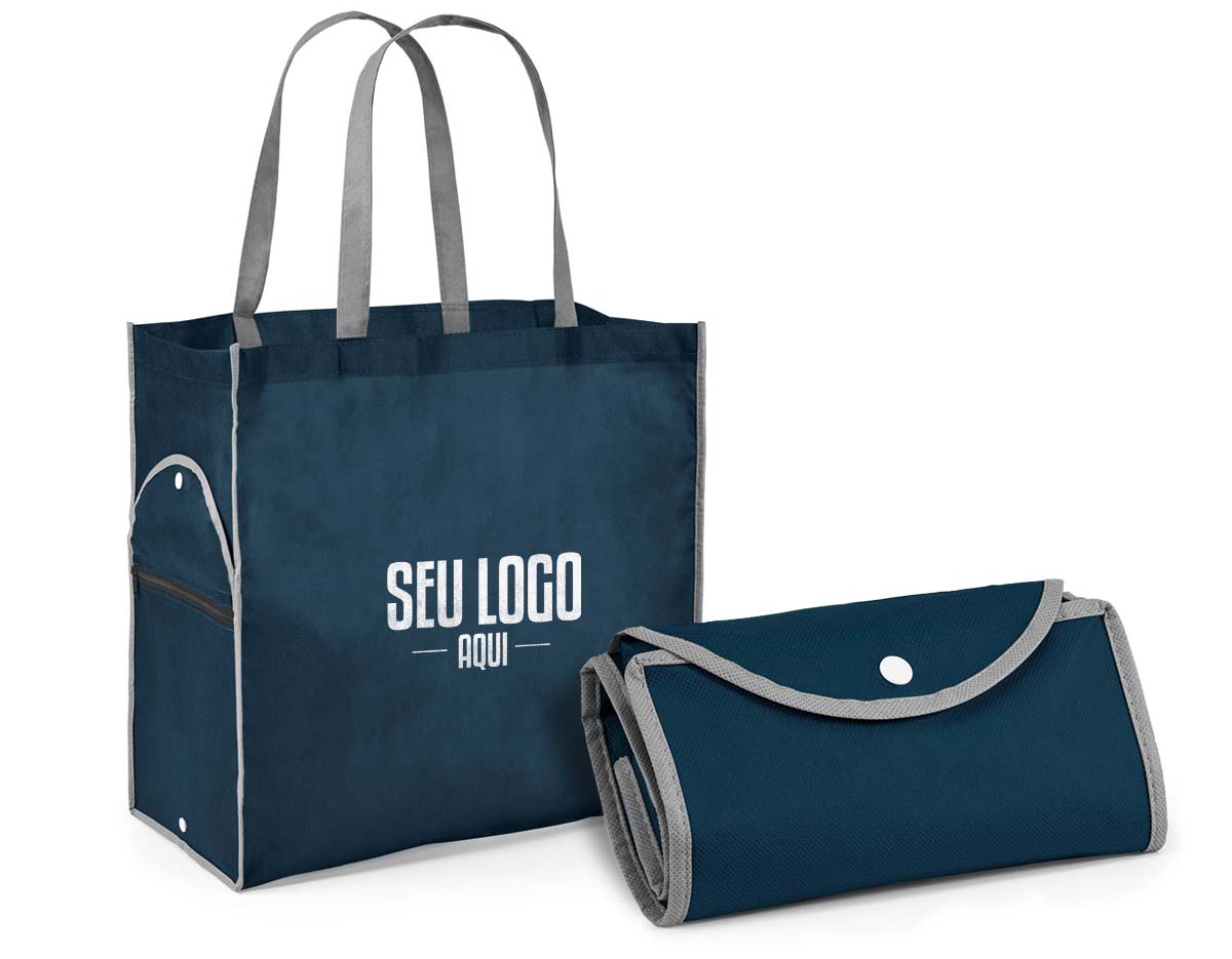 Sacola dobrável. Non-woven: 80 g/m². Alças de 65 cm. Dobrado: 200 x 120 mm| Aberto: 400 x 450 x 200 mm.