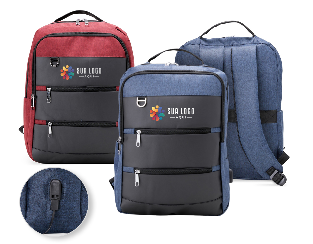 Mochila de nylon 26 Litros com detalhes em couro sintético e quatro compartimentos, sendo o principal com bolso para notebook 15,6. Com divisórias internas para acessórios, a mochila possui bolso lateral, suporte externo USB e alça para engate em malas de viagem.