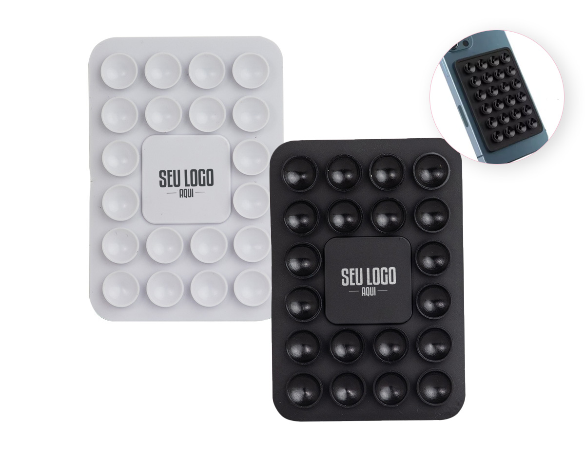 Libere o uso das mãos e utilize nossa ventosa para fixar celulares em superfícies lisas. Produzida em PVC flexível, conta com 20 ventosas que garantem a fixação dos celulares em superfícies como mesas, espelhos, janelas e até no carro, sem a necessidade de ferramentas extras. Basta remover o adesivo 3M, colá-lo no celular e fixá-lo na superfície. Além de sua praticidade, o suporte oferece um espaço exclusivo para personalização, tornando-se uma excelente opção para divulgar a marca do cliente.
