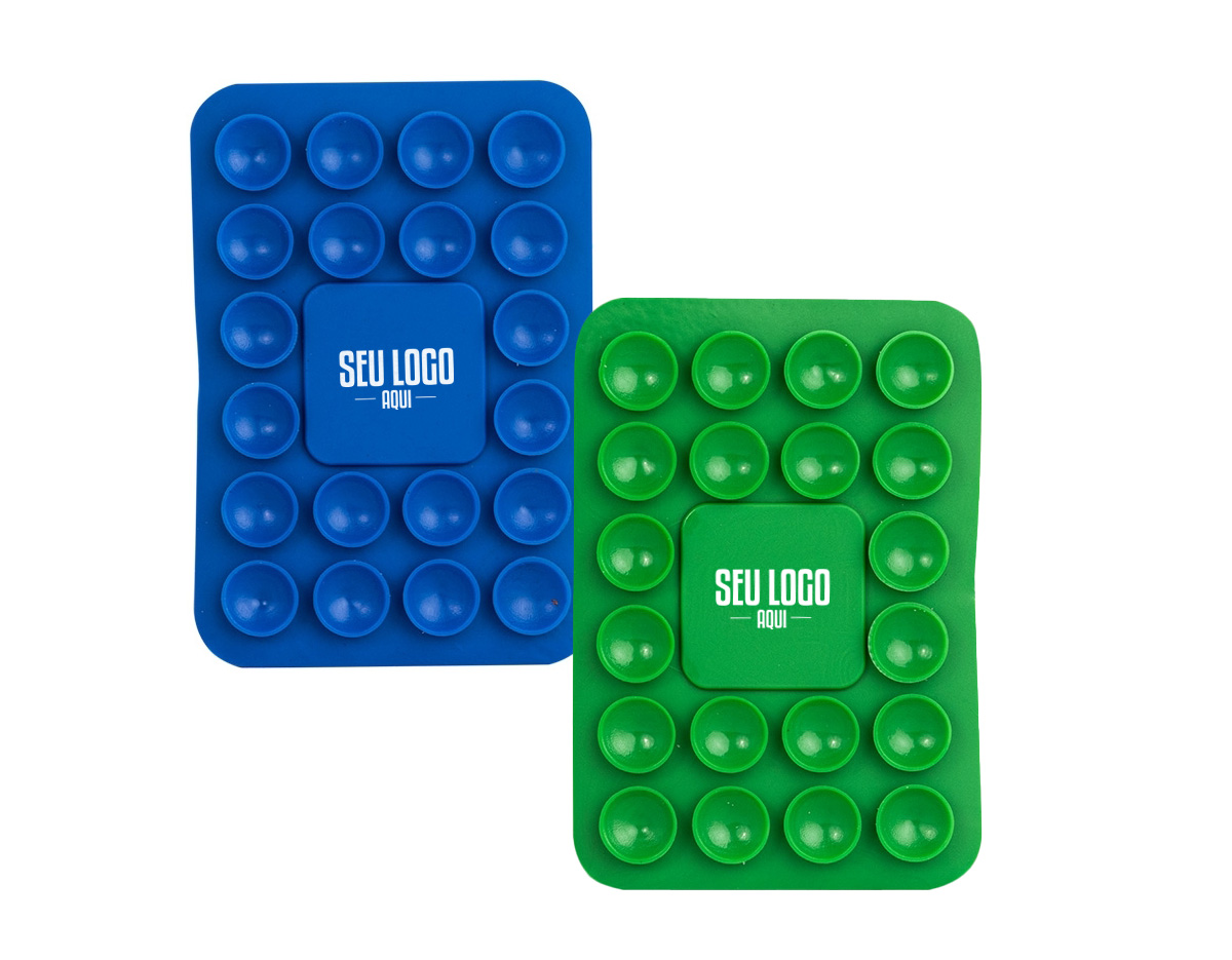 Libere o uso das mãos e utilize nossa ventosa para fixar celulares em superfícies lisas. Produzida em PVC flexível, conta com 20 ventosas que garantem a fixação dos celulares em superfícies como mesas, espelhos, janelas e até no carro, sem a necessidade de ferramentas extras. Basta remover o adesivo 3M, colá-lo no celular e fixá-lo na superfície. Além de sua praticidade, o suporte oferece um espaço exclusivo para personalização, tornando-se uma excelente opção para divulgar a marca do cliente.