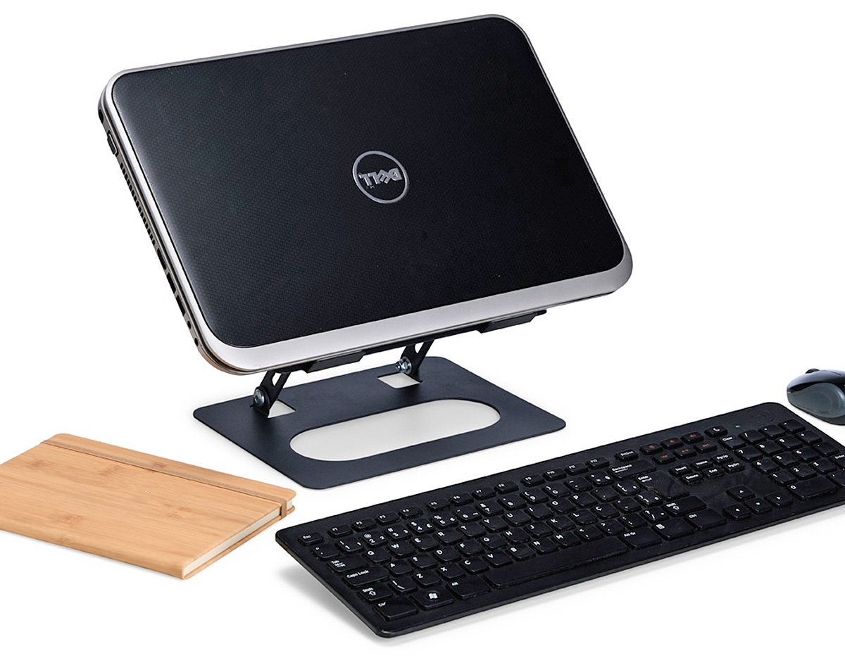 Suporte de aço articulado para notebook com ajuste de ângulo, tiras antiderrapantes e aberturas para ventilação. Oferece conforto e ergonomia em casa, no trabalho ou na escola.